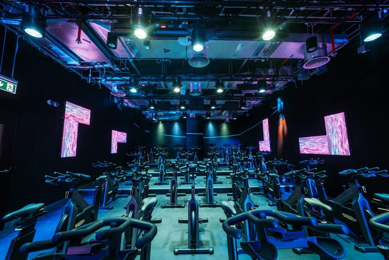The 1Rebel ride studio at ICD Brookfield Place, with rows of exercise bikes