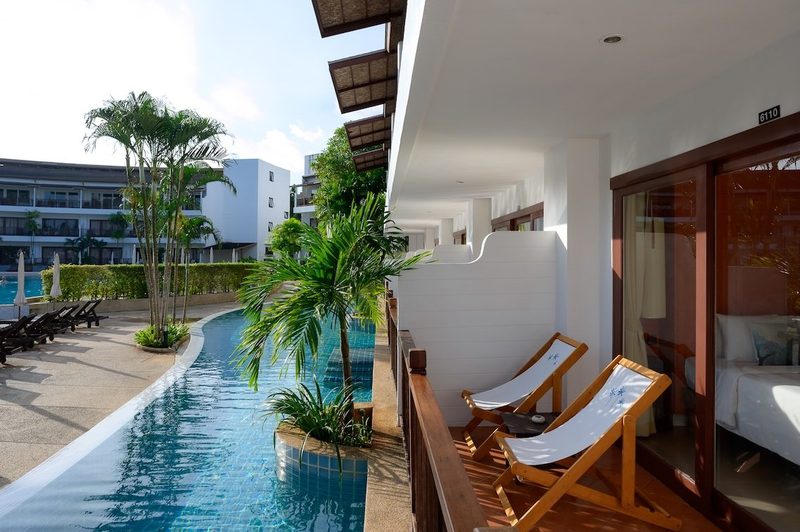 Balcony loungers beside a pool channel at Occidental Bangtao Beach Resort