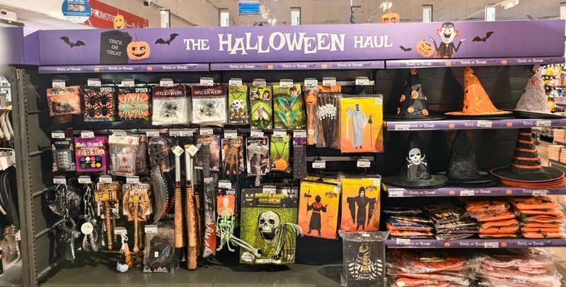 A wall of Halloween costumes, masks and hats at Choithrams