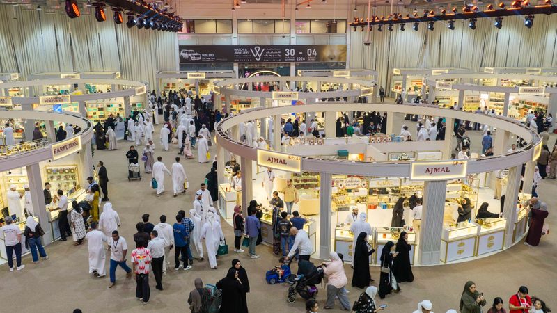 Crowds browse circular perfume stands including Ajmal and Parfumani at the exhibition at Expo Centre Sharjah