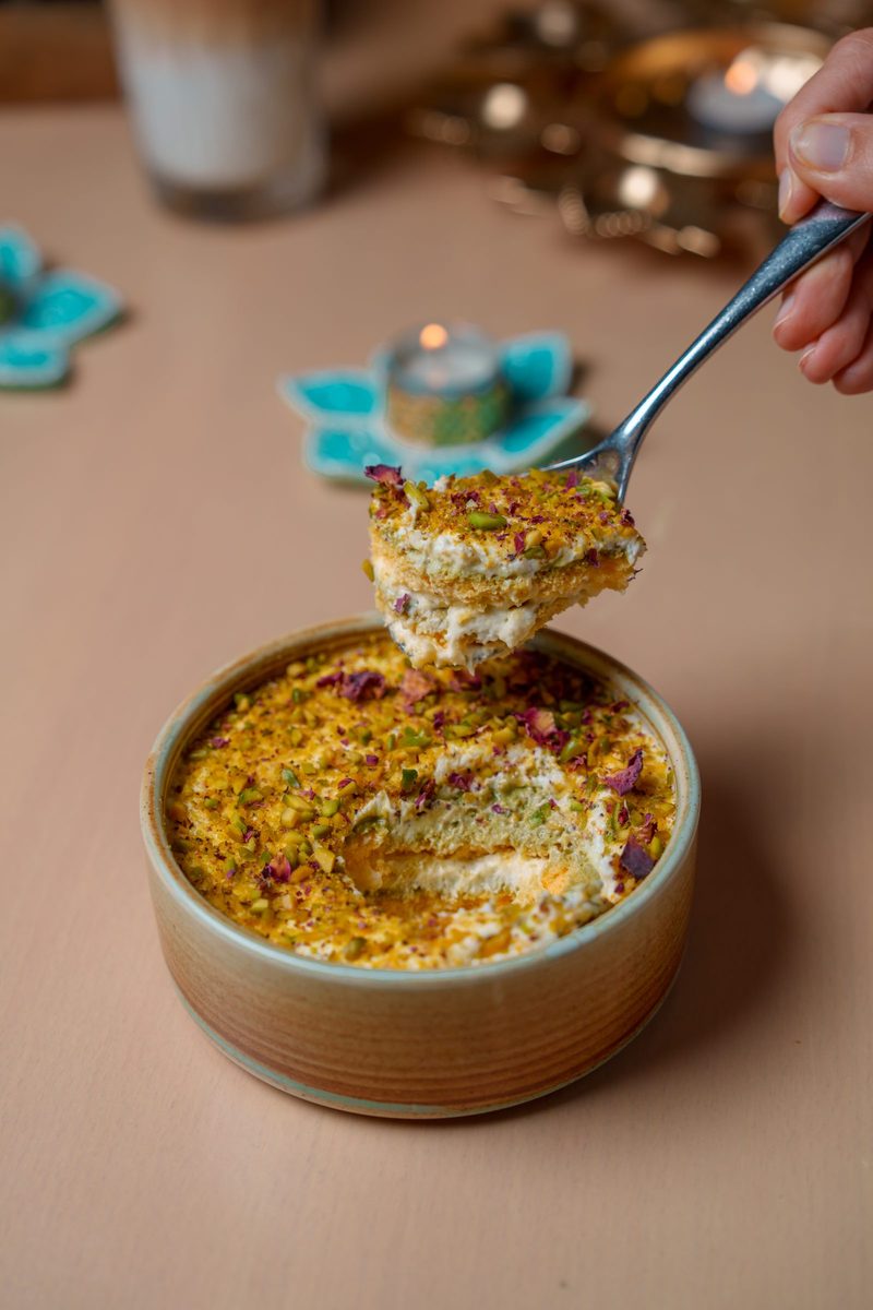 A spoonful lifted from the pistachio and rose dessert on the hotel’s Diwali menu