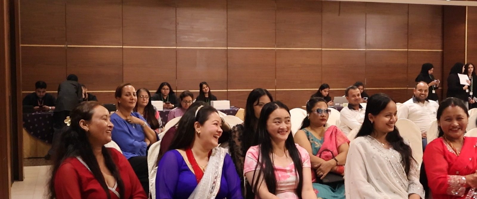 Women and families seated in rows at the Smart Sustainability Family event at India Club, Dubai