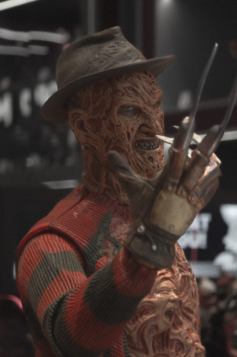 Collectible figure of Freddy Krueger with his clawed glove and hat