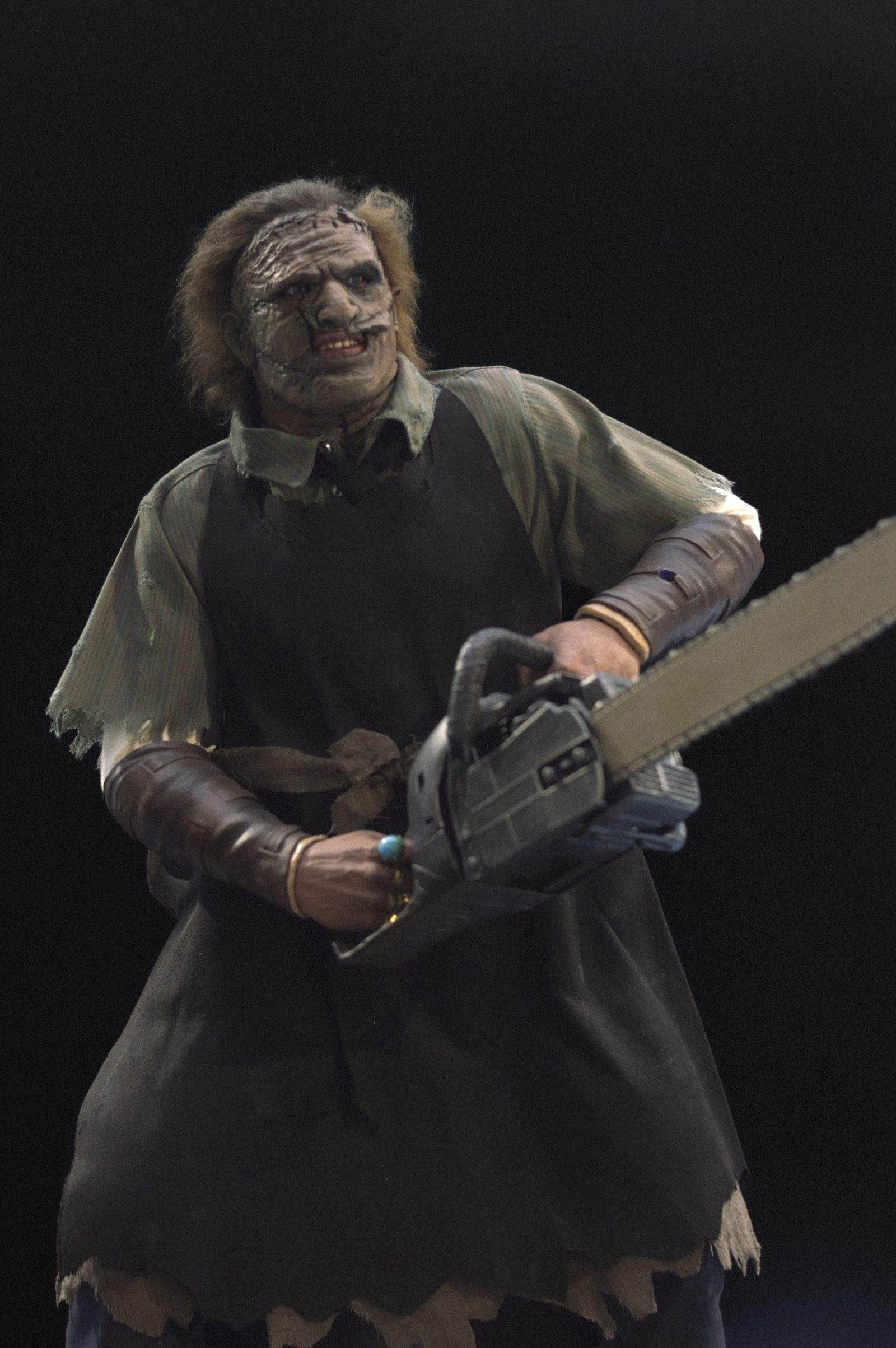Collectible figure of Leatherface holding a chainsaw