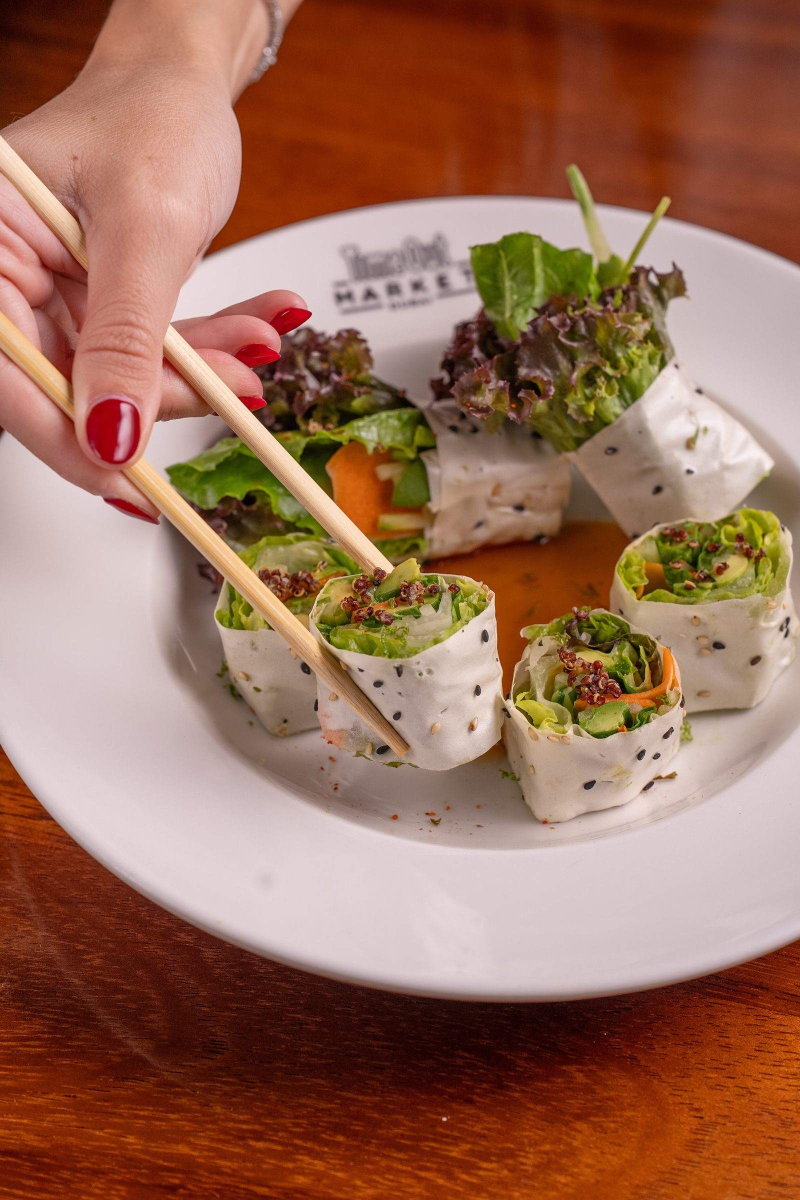 Riceless Yasai Maki from REIF at Time Out Market Dubai, picked up with chopsticks